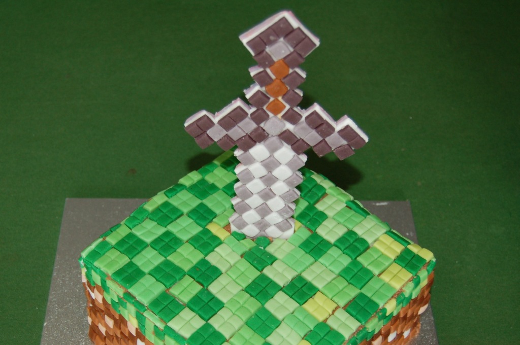 Sword added to cake.